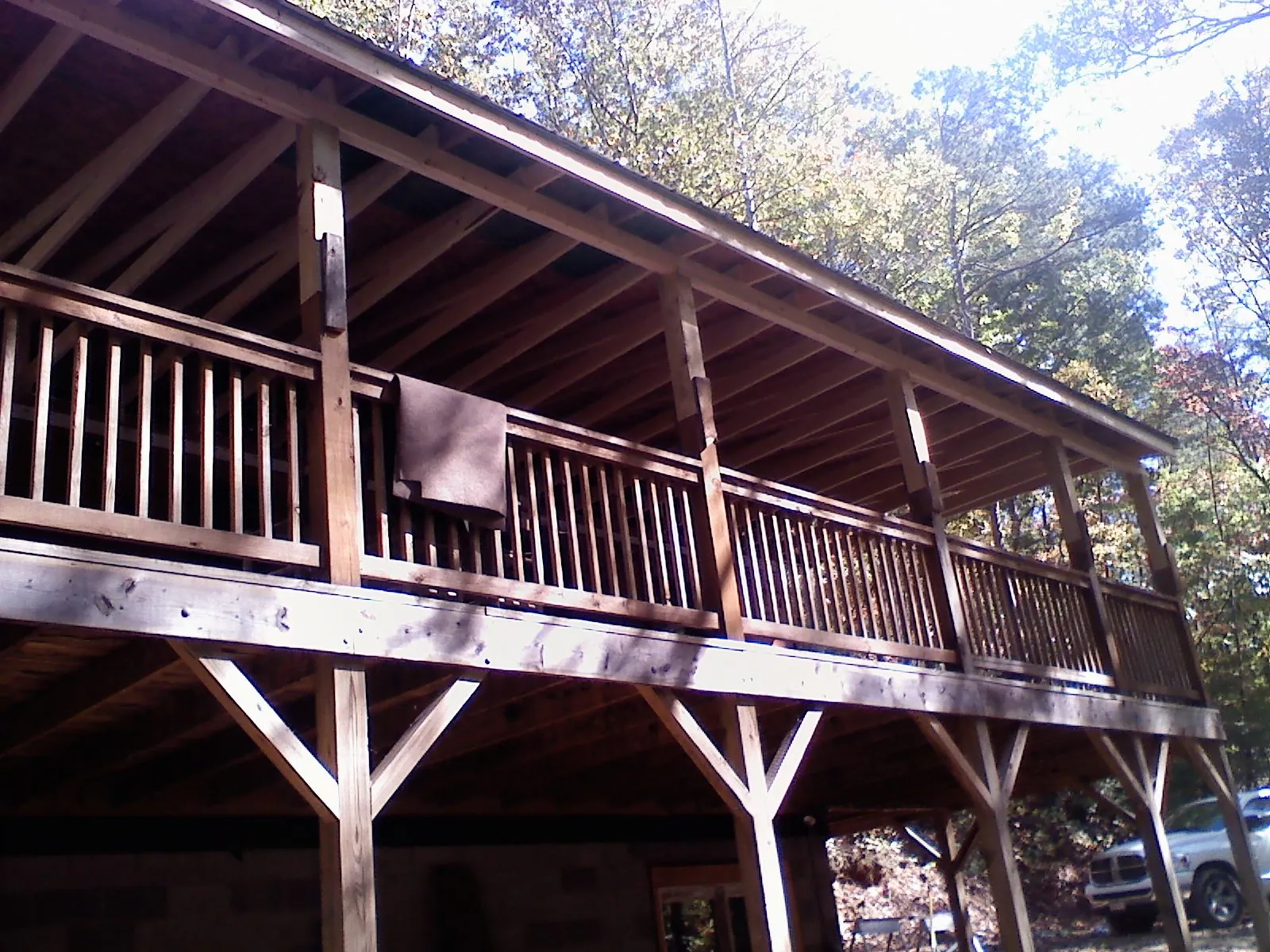 Timber framing under a new elevated porch and deck in Cohutta